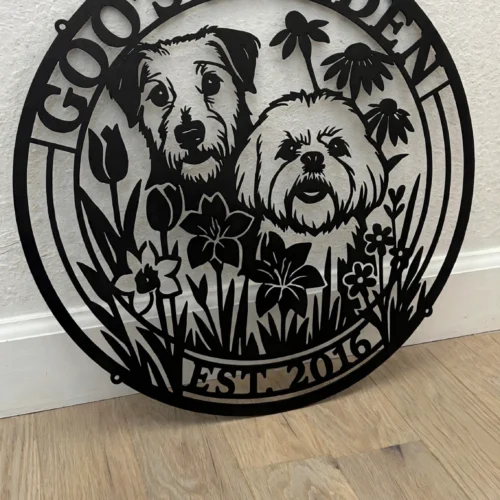 Goo's Garden metal sign, leaning against a wall on a light oak floor